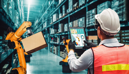Smart robot arm systems for innovative warehouse and factory digital technology . Automation manufacturing robot controlled by industry engineering using IOT software connected to internet network .