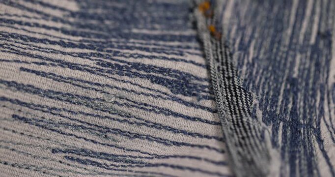 blue repaired jeans after they are torn, patching with a lot of threads after repairing jeans with a lot of scuff