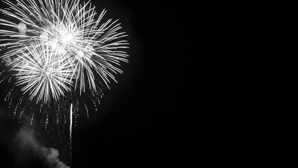 Fototapeta premium Monochrome Fireworks Explosion on Black Background With Copy Space