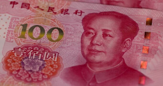 red Chinese cash in denominations of one hundred yuan and 100 American dollars , a pile of paper cash of American and Chinese money , Chinese banknotes of 100 yuan