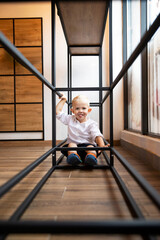 The child is indulging. The boy makes grimaces.