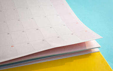 Close-up of a Monthly Calendar with Blue Background