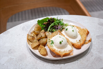 Eggs Benedict breakfast in a restaurant.