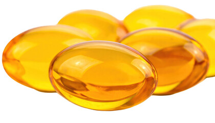 Close-up of glossy, golden gel capsules, possibly supplements, against black backdrop