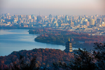 West Lake city and Leifeng Pagoda autumn sunrise morning mist scenery, Hangzhou, China