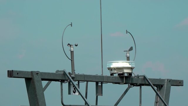 Close-up of a weather monitoring station with sensors and scientific equipment under a clear sky in S&aacute;toralja&uacute;jhely, Zempl&eacute;n Adventure Park, Hungary.