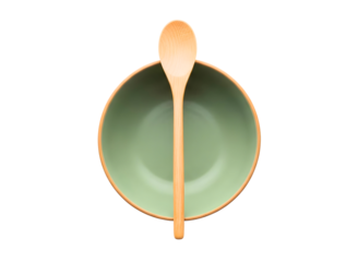 Wooden spoon in green bowl