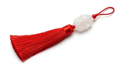 Red tassel charm with cloud-shaped bead isolated on white background