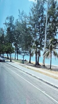 road along the coast of Samila Beach in Songkhla, Thailand