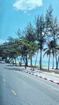 road along the coast of Samila Beach in Songkhla, Thailand