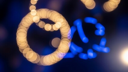 Golden Christmas Ornaments Hanging from Tree.
