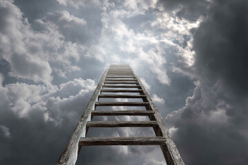 Wooden ladder rising into cloudy sky, symbolizing long-term goals, progress, and an uncertain future path.