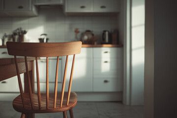 A wooden chair lit by soft light in a quiet kitchen, capturing a paused domestic moment without people.