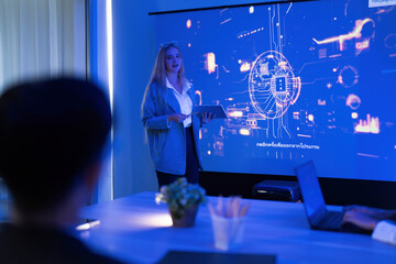 Business presentation on technology trends with a female speaker and digital graphics in a modern conference room