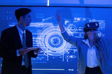 Business professionals exploring virtual reality technology during a presentation in a technology-focused office setting