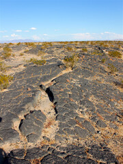 Volcanic rock scatters the center of Amboy Crater in the deserts of southern California
