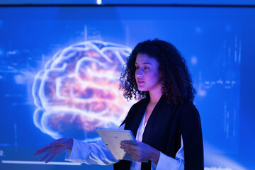 Young woman presenting about brain technology in a futuristic setting with digital graphics