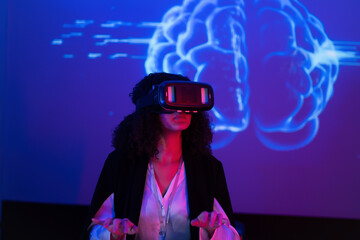 Exploring virtual reality technology with a headset and brain visuals in an interactive setting