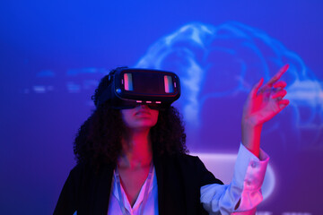 Exploring virtual reality in a futuristic setting with vibrant colors and digital projections