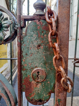Rusty iron lock with metal chain