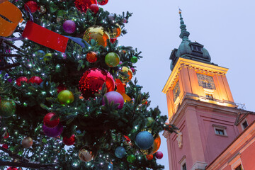 Decorated Christmas tree in front of the Royal residence in Warsaw, Poland during winter season