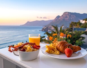 Breakfast spread on a balcony with ocean vista at dawn