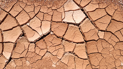Cracked land texture, cracks on burnt arid soil surface close up, dead desert background, dry climate, drought, global warming, abstract art cracks pattern, broken concrete, cement, aged clay, plaster © Vera Shestak