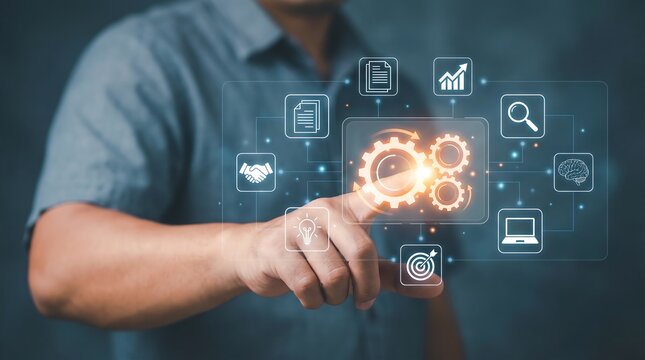 Businessman's hand touches glowing digital gears representing business processes, strategy, analytics, and innovation on a futuristic interface screen. - Powered by Adobe