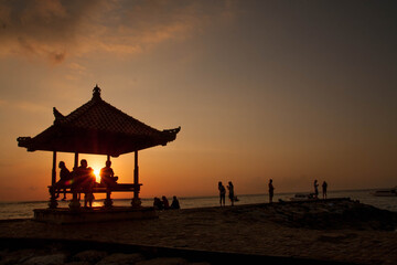 Golden Sanur Sunrise: Silhouette of a Traditional Balinese Gazebo at Dawn