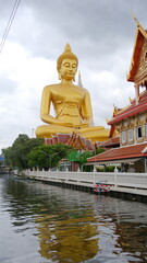 The giant seated buddha statue at the Wat Paknam Phasi Charoen temple, Famous place in Bangkok.
