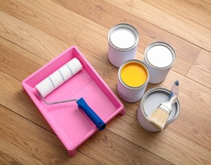 Set of paint rollers, brush, paint cans and pink tray neatly arranged on clean wooden floor, suggesting careful preparation for renovation.