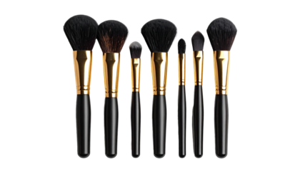 Seven makeup brushes, black handles with gold ferrules, arranged neatly