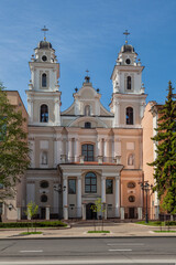 Catholic church facade with two towers on sunny day