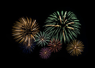 Festive colorful fireworks display isolated on black background for celebration and anniversary