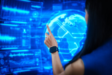 Futuristic woman interacting with virtual holographic interface, touching transparent digital screens in blue cyber environment, data controly, immersive human computer interaction.