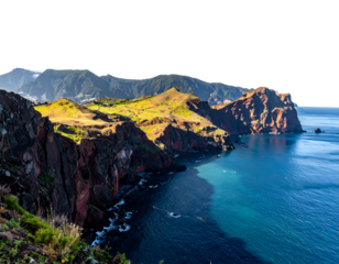 A coastal scene showcases dramatic cliffs and rolling hills bathed in sunlight, meeting the sparkling blue ocean