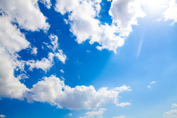blue sky background with tiny clouds.