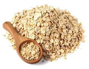 Close-up of rolled oats in a wooden spoon and a pile on white