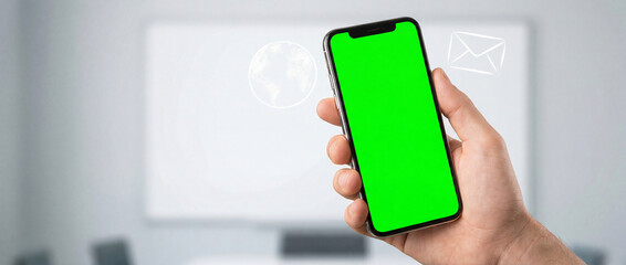 Hand Holding Smartphone with Green Screen for Online Communication Concept