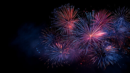 Spectacular Blue and Pink Firework Bursts Exploding in Dark Night Sky