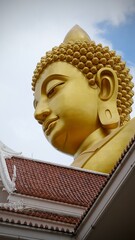 Bangkok, Thailand - September 25 2025 : The giant seated buddha statue at the Wat Paknam Phasi Charoen temple, Famous place in Bangkok.
