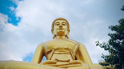 Bangkok, Thailand - September 25 2025 : The giant seated buddha statue at the Wat Paknam Phasi Charoen temple, Famous place in Bangkok.

