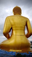 Bangkok, Thailand - September 25 2025 : The giant seated buddha statue at the Wat Paknam Phasi Charoen temple, Famous place in Bangkok.
