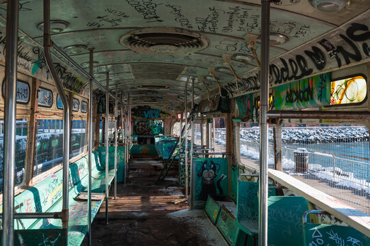 Abandoned railcar interior with graffiti