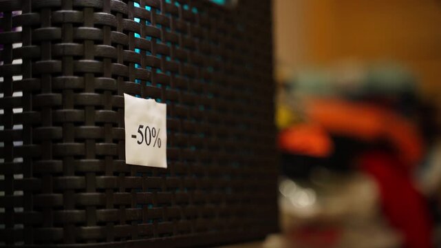 A sticker with minus 50 percent was stuck on a plastic box in the pantry