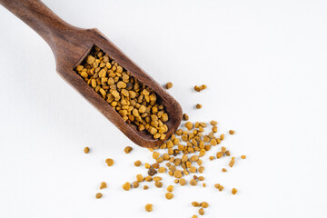 Honey bee pollen in wooden scoop
