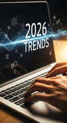 "Hands Typing on Laptop Keyboard with '2026 Trends' on Screen &mdash; Research and Market Analysis"
