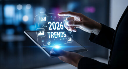 "Business Professional Holding Tablet with Holographic 2026 Trends Data and Technology Icons"
