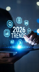 "Business Professional Holding Tablet with Holographic 2026 Trends Data and Technology Icons"
