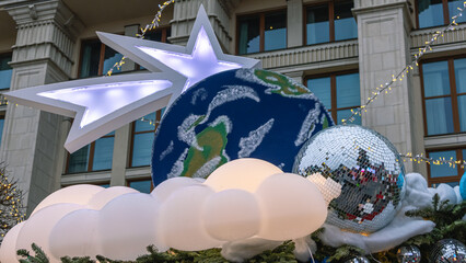 Christmas trees are decorated with colorful decorations during the New Year holidays. Festive decoration on Christmas Eve. The building is decorated with festive New Year decorations.